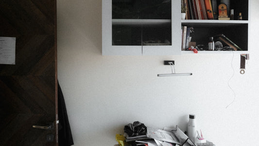 a room with a bookshelf and a bunch of books