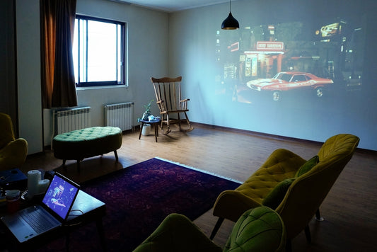 A film is projected on a white wall.